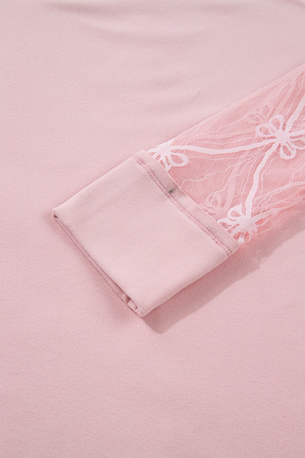 Light pink long sleeve tee from Dear-Lover Dropshipping featuring textured patchwork and a bow detail, made of polyester and elastane.