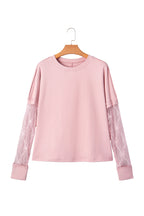 Light pink solid color long sleeve tee from Dear-Lover with textured patchwork and bow details, made of polyester and elastane.