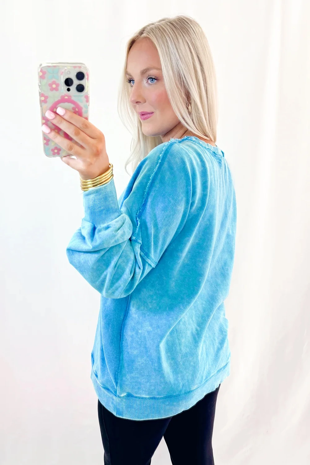 Blue mineral wash Dear-Lover sweatshirt with raw seams, double patched pockets, and a pullover design, made from cotton-polyester blend.