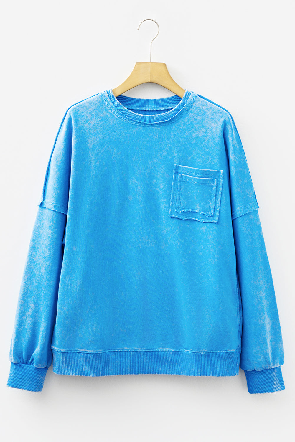 Blue mineral wash Dear-Lover sweatshirt with raw seams, double patched pockets, and a pullover design, made from cotton and polyester.