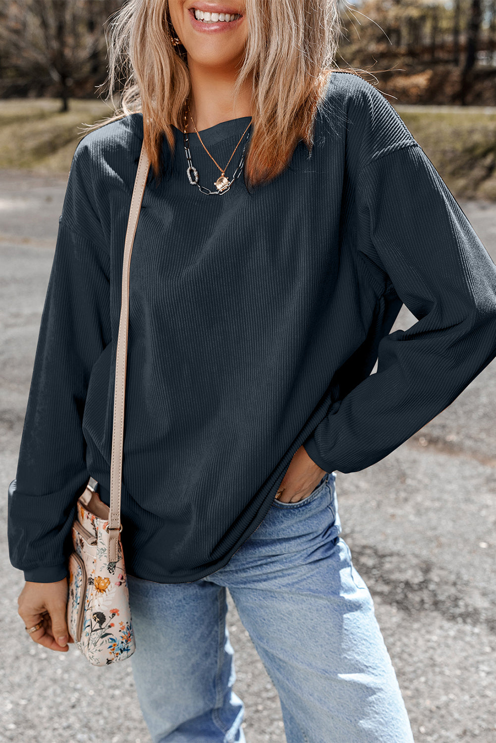 Orange ribbed corduroy oversized sweatshirt by Dear-Lover, featuring a cozy, relaxed fit and textured fabric detail.