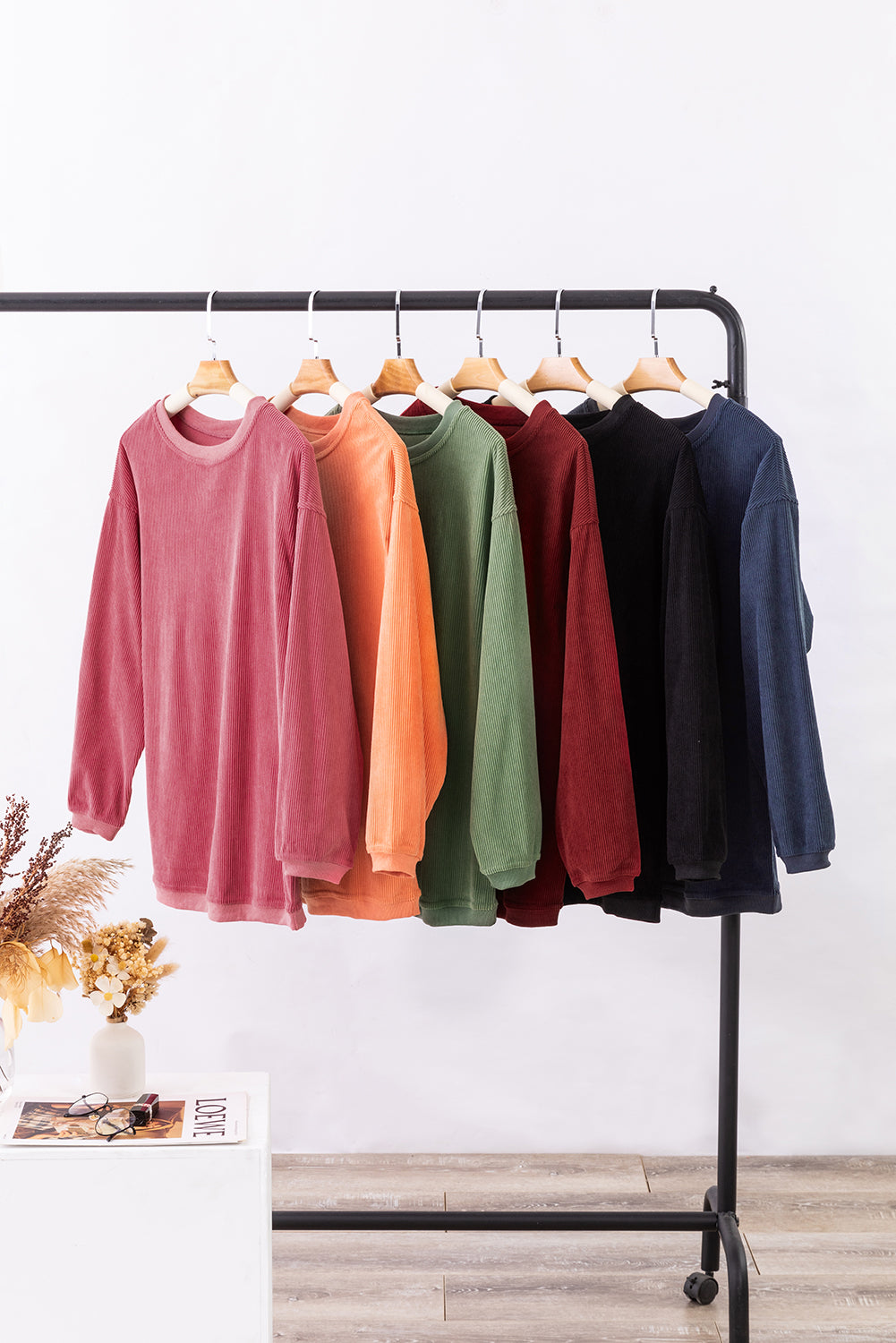 Orange ribbed corduroy oversized sweatshirt by Dear-Lover Dropshipping, showing its relaxed fit and textured fabric.