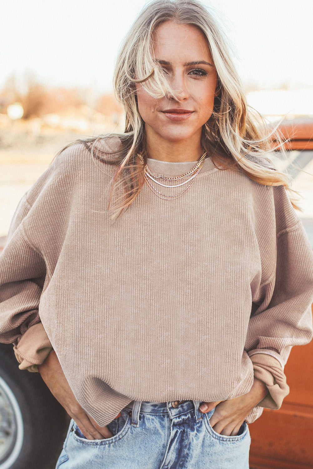 Orange ribbed corduroy oversized sweatshirt from Dear-Lover Dropshipping, showing the relaxed fit and textured fabric.
