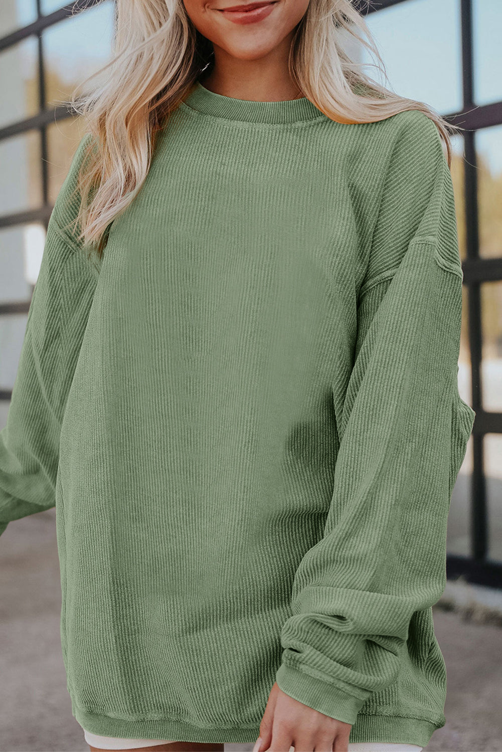 Orange ribbed corduroy oversized sweatshirt by Dear-Lover Dropshipping, featuring a cozy, relaxed fit and textured fabric.