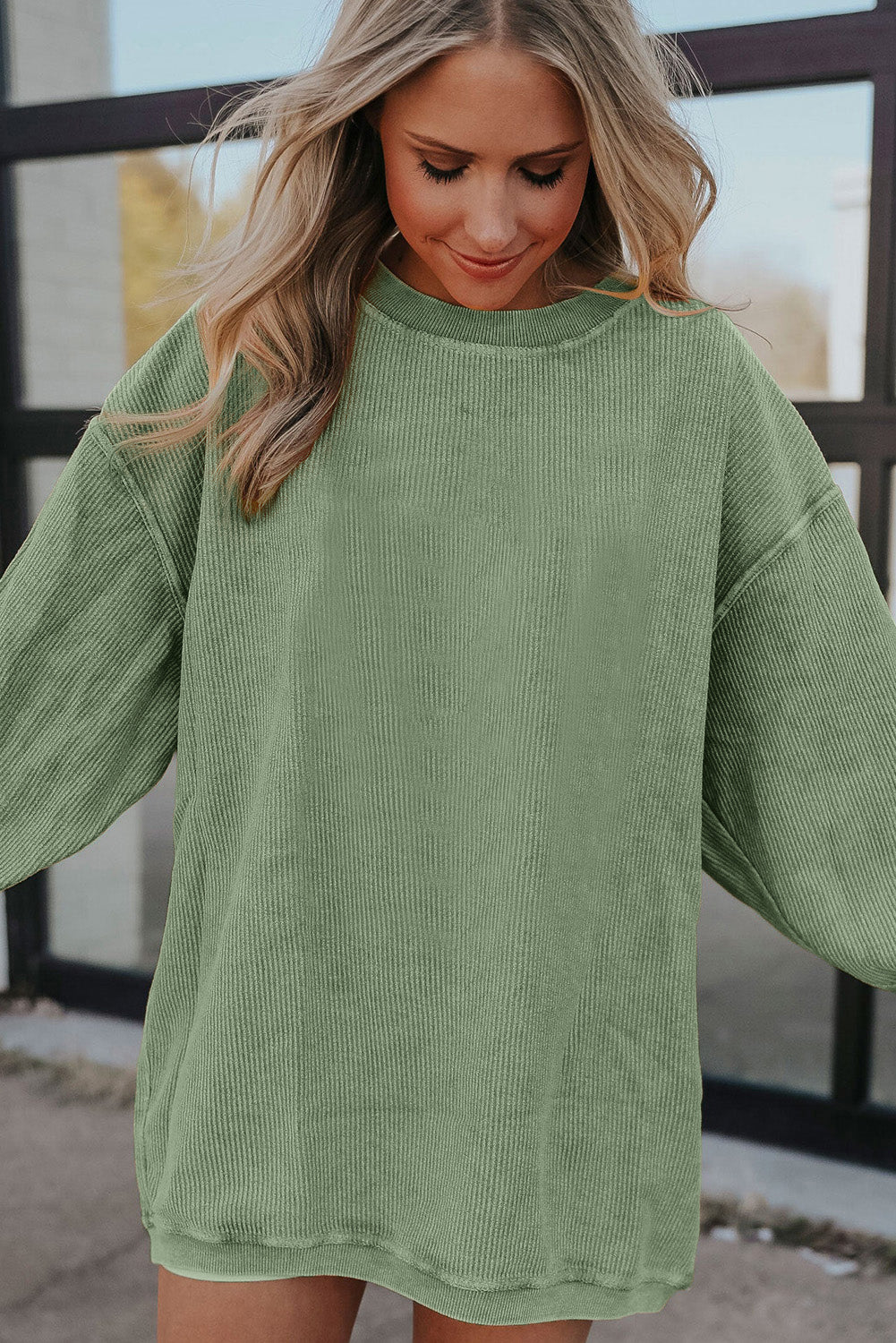 Orange ribbed corduroy oversized sweatshirt by Dear-Lover Dropshipping, featuring a cozy, relaxed fit and textured fabric.