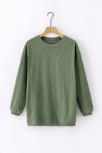 Orange ribbed corduroy oversized sweatshirt by Dear-Lover, showing a cozy, relaxed fit with ribbed texture and long sleeves.