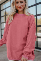 Orange ribbed corduroy oversized sweatshirt by Dear-Lover Dropshipping, featuring a cozy, relaxed fit and textured fabric.
