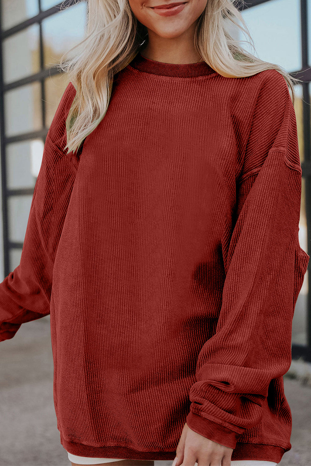 Orange ribbed corduroy oversized sweatshirt from Dear-Lover, featuring a cozy, relaxed fit and textured fabric.