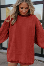 Orange ribbed corduroy oversized sweatshirt by Dear-Lover, featuring a relaxed fit and soft, textured fabric.