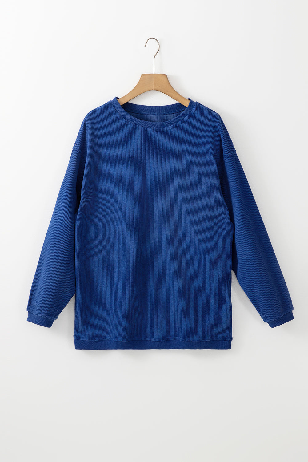 Orange ribbed corduroy oversized sweatshirt by Dear-Lover Dropshipping, featuring a relaxed fit and textured fabric.