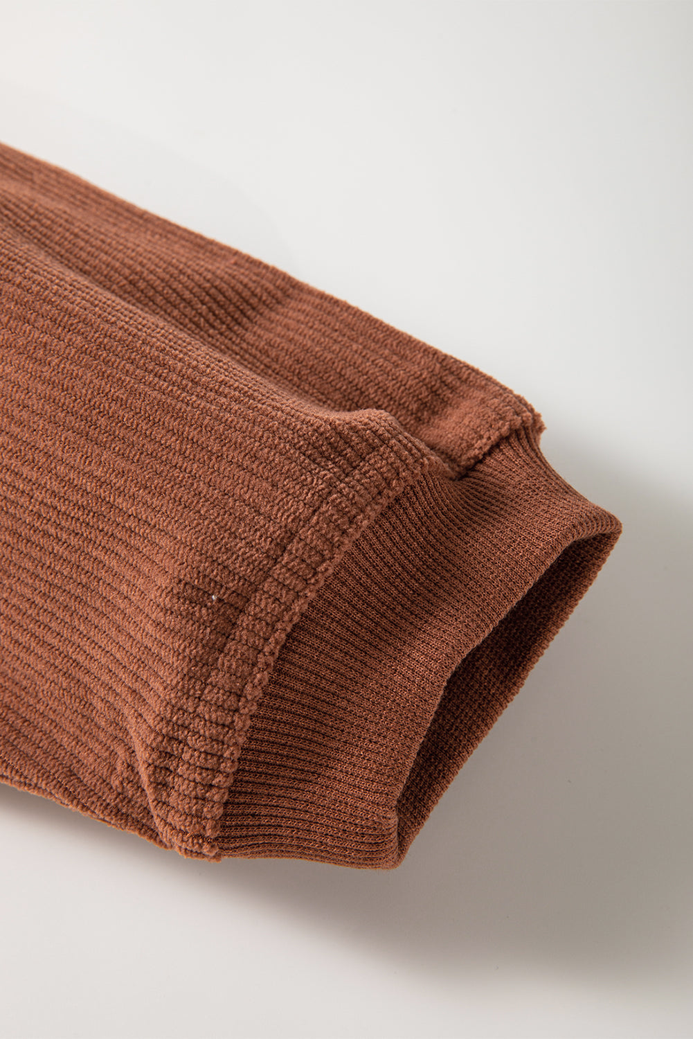 Orange ribbed corduroy oversized sweatshirt by Dear-Lover Dropshipping, showing the relaxed fit and textured fabric detail.