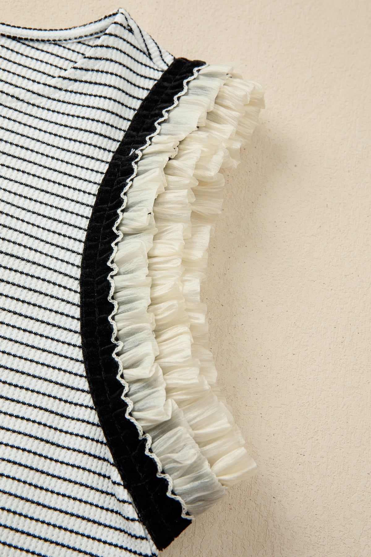 Black stripe casual tank top with contrasting ruffle trim, made from polyester and elastane, by Dear-Lover.