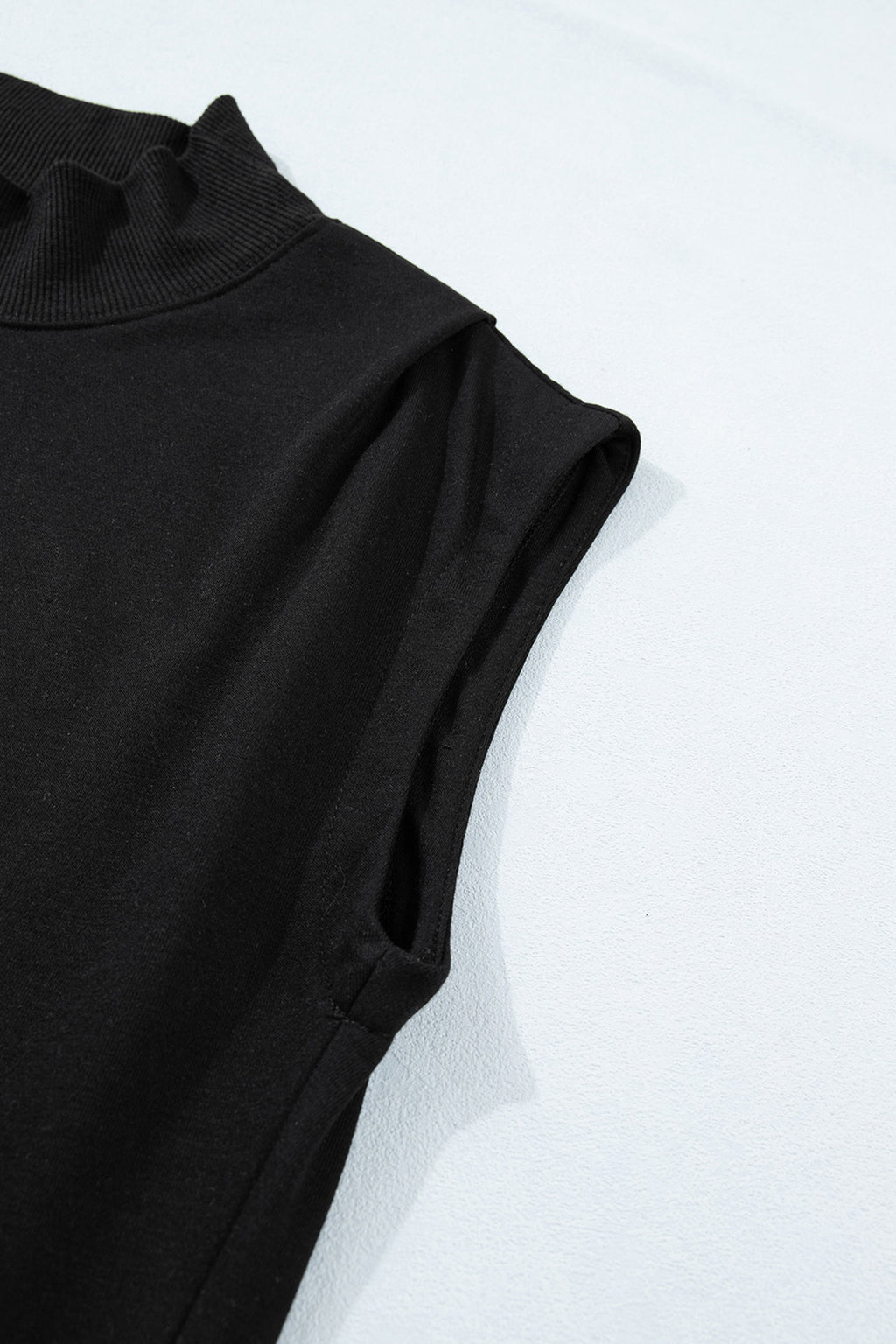 Black solid color high neck cap sleeve loose top by Dear-Lover, made of polyester and cotton, shown on a hanger.