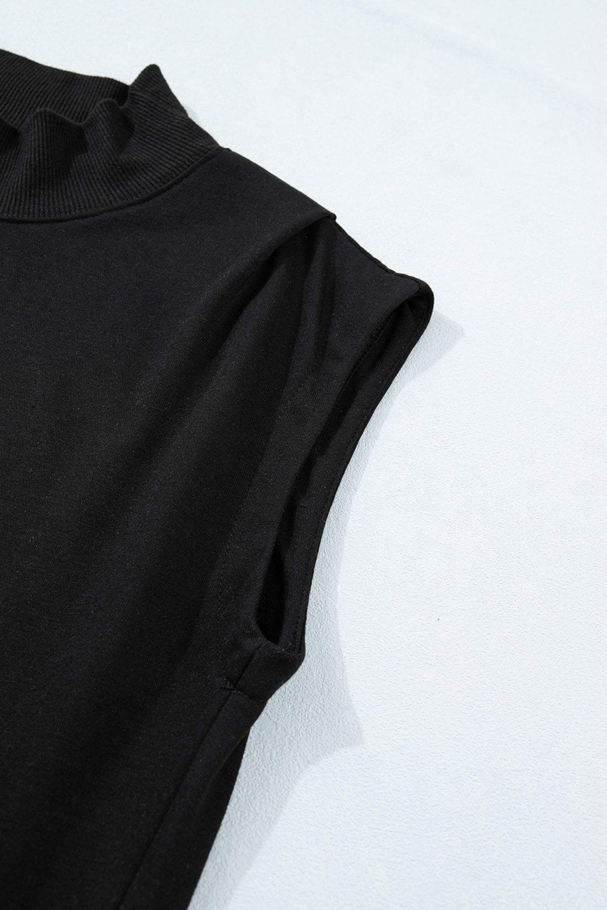 Black solid color high neck cap sleeve loose top by Dear-Lover, made of polyester and cotton, shown on a hanger.