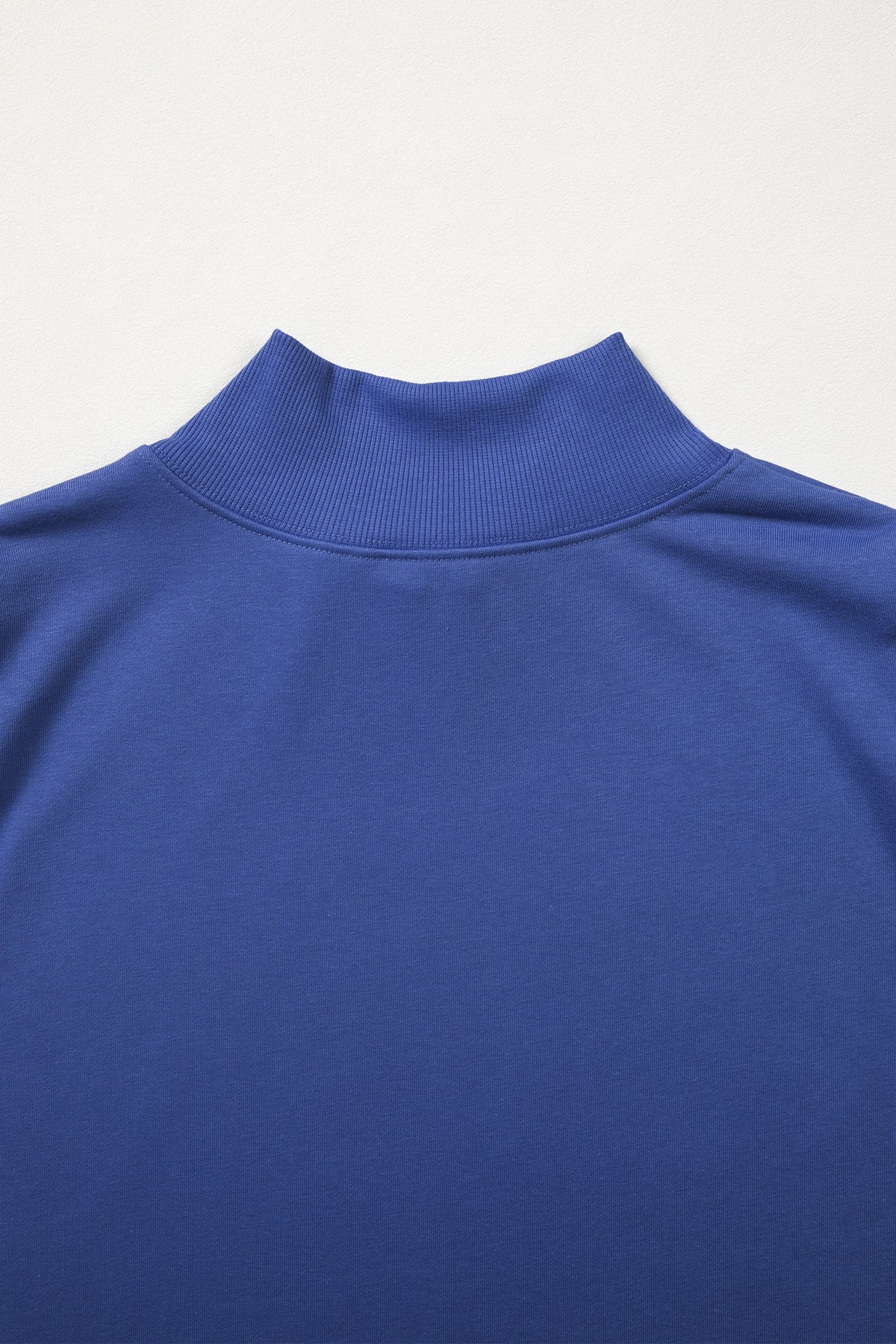 Black solid color high neck cap sleeve loose top from Dear-Lover, made of polyester and cotton, displayed on a hanger.