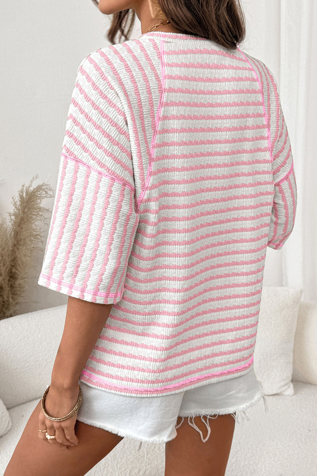 Pink striped textured knit loose top with half sleeves and split hem, made from polyester, viscose, and elastane, by Dear-Lover.