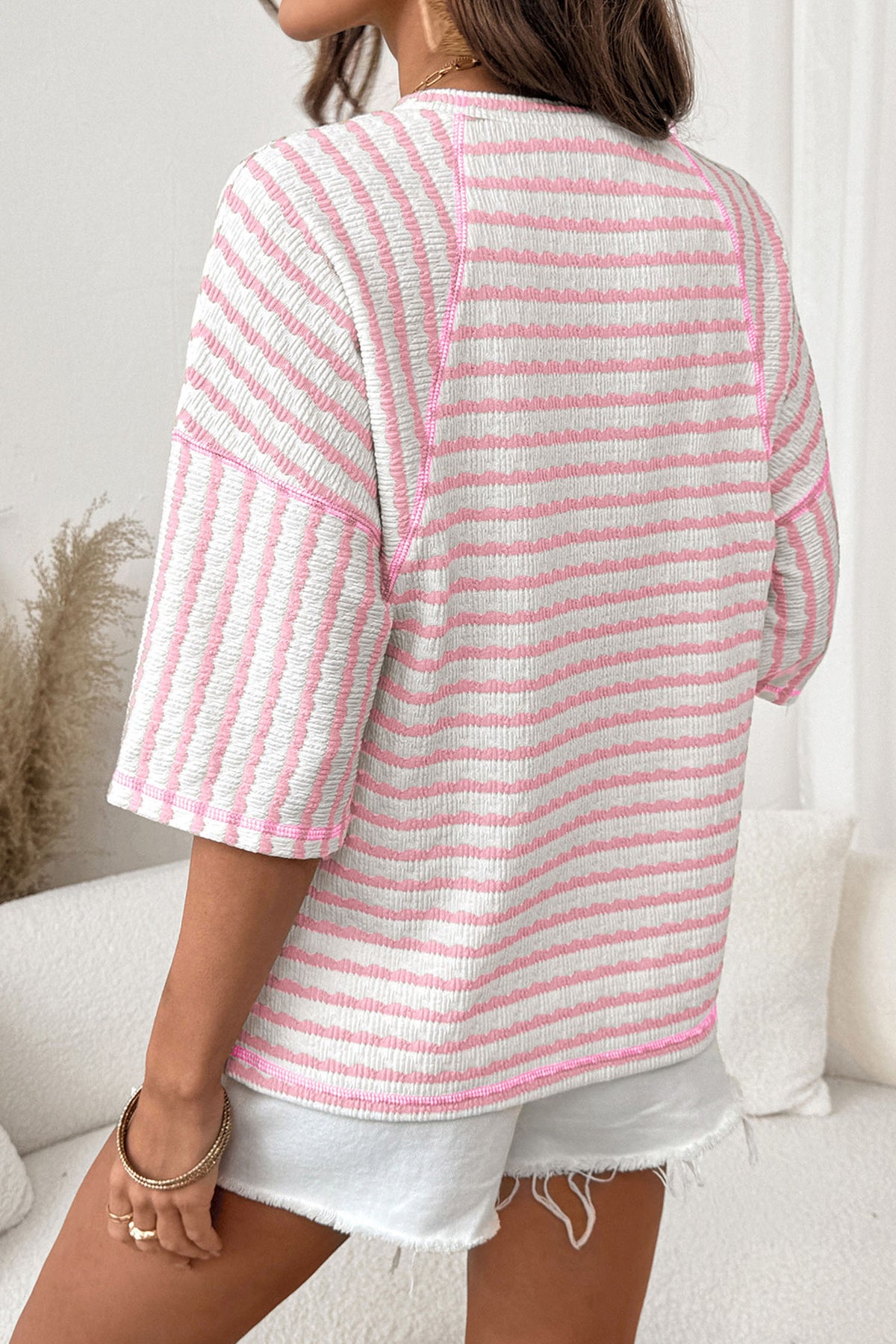Pink striped textured knit loose top with half sleeves and split hem, made from polyester, viscose, and elastane, by Dear-Lover.