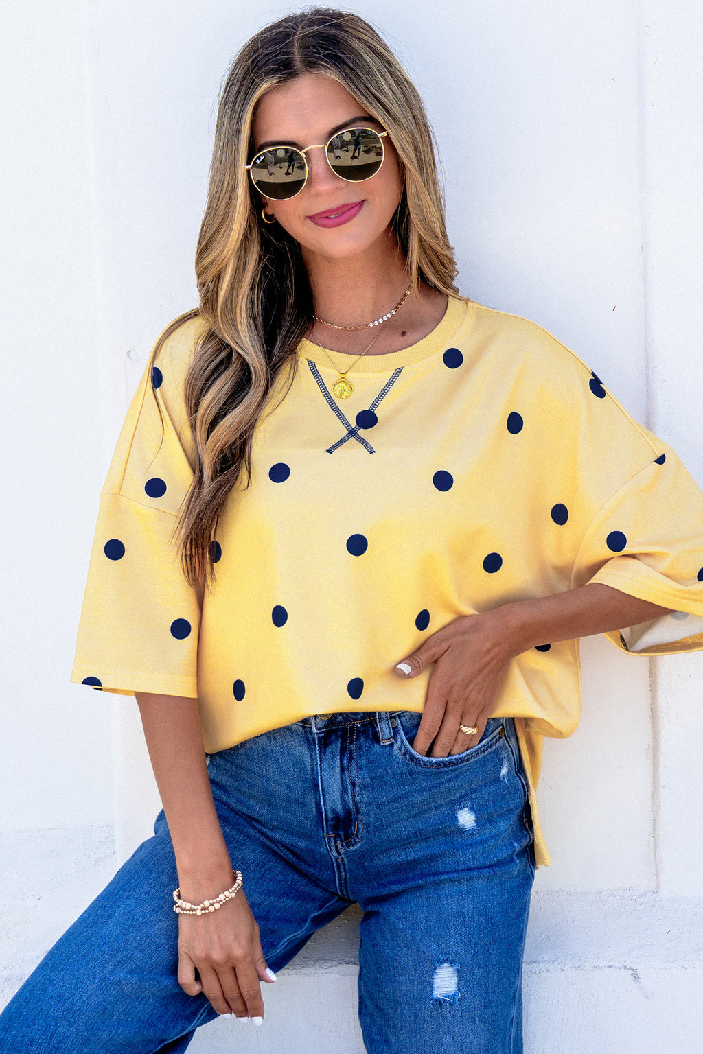 Yellow polka dot print oversized tee by Dear-Lover, featuring crossed seam detail and relaxed fit, made of polyester and elastane.