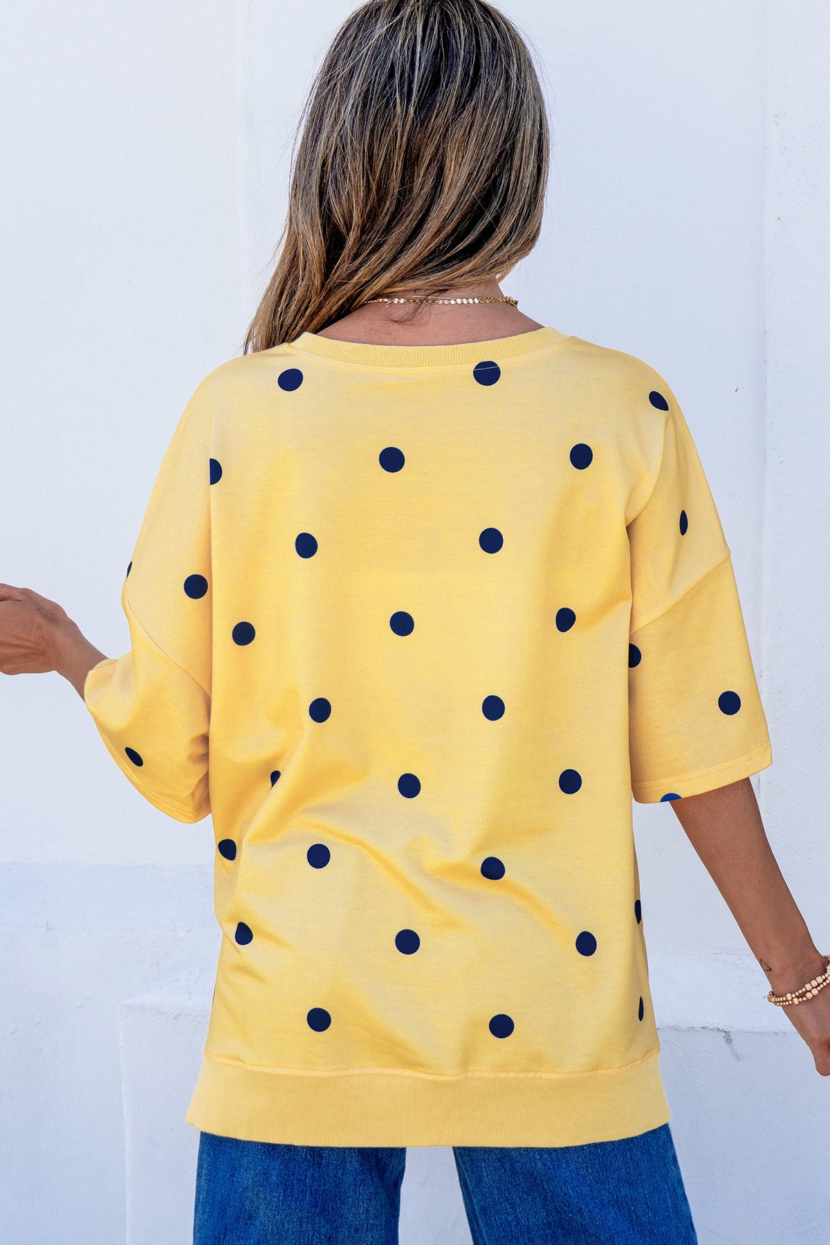 Yellow polka dot print oversized tee from Dear-Lover Dropshipping with crossed seam detail, made of polyester and elastane.