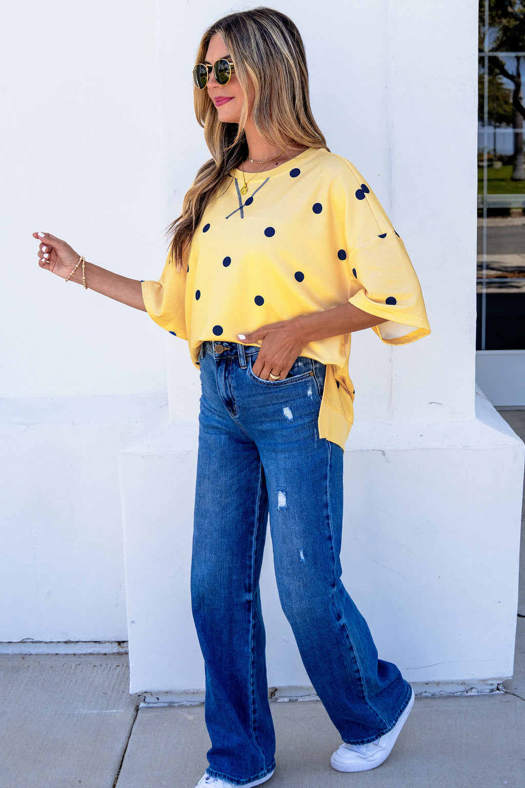 Yellow polka dot print oversized tee by Dear-Lover, featuring crossed seam detail and relaxed fit, made from polyester and elastane.