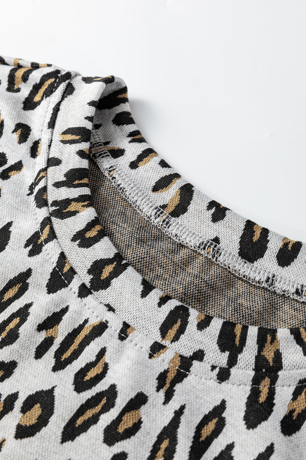 Beige leopard print casual tee and pants two-piece set by Dear-Lover, featuring comfortable polyester-elastane fabric.