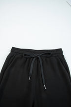 Black zip collar long sleeve top and drawstring pants set from Dear-Lover, stylish two-piece set for versatile casual wear.