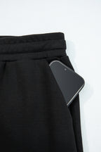 Black zip collar long sleeve top and drawstring pants set by Dear-Lover, stylish two-piece polyester and viscose outfit.