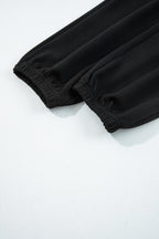 Black zip collar long sleeve top and drawstring pants set from Dear-Lover, stylish two-piece polyester and viscose outfit.