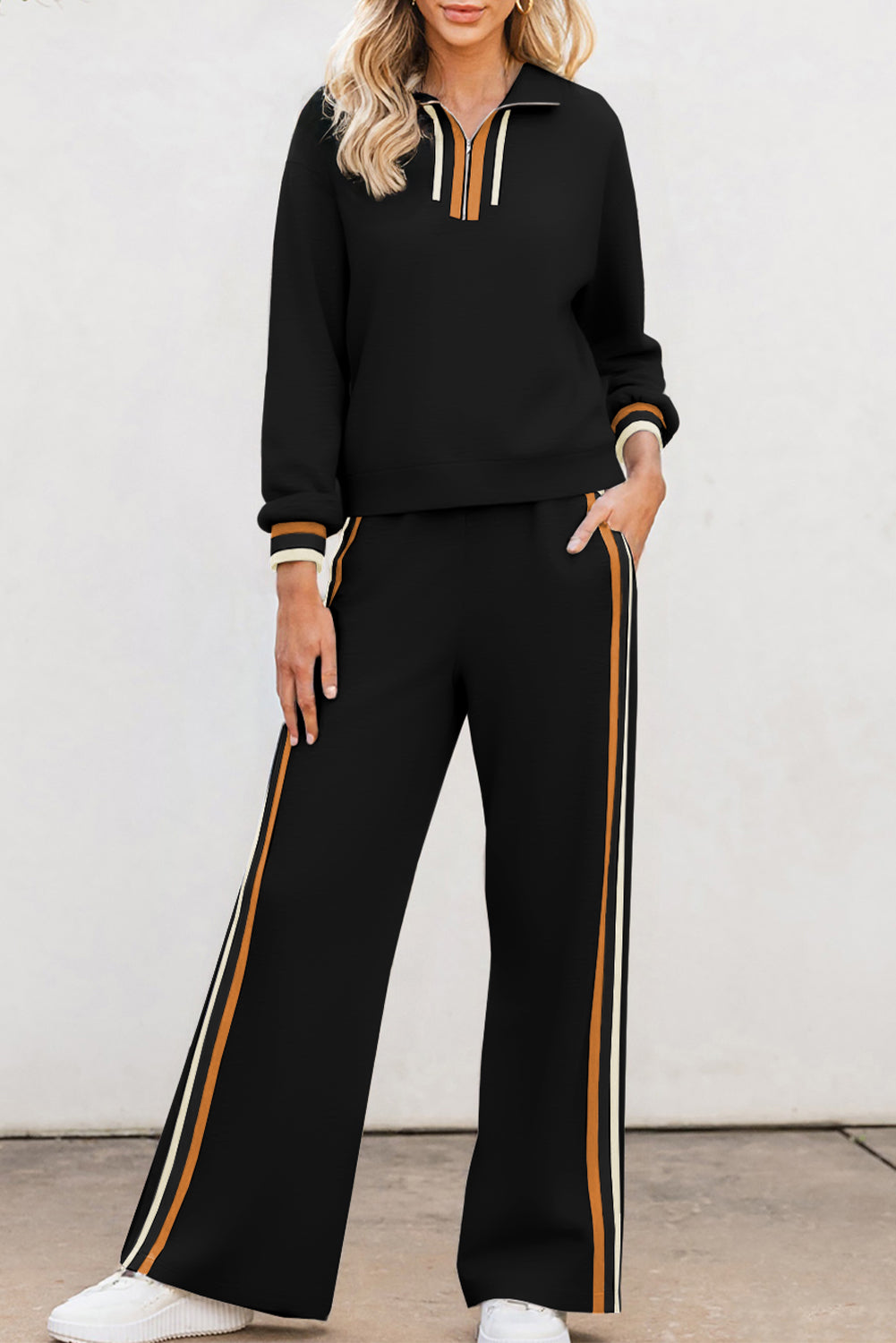 Striped patchwork quarter zip pullover and loose pants set by Dear-Lover in black, made of polyester, viscose, and elastane.