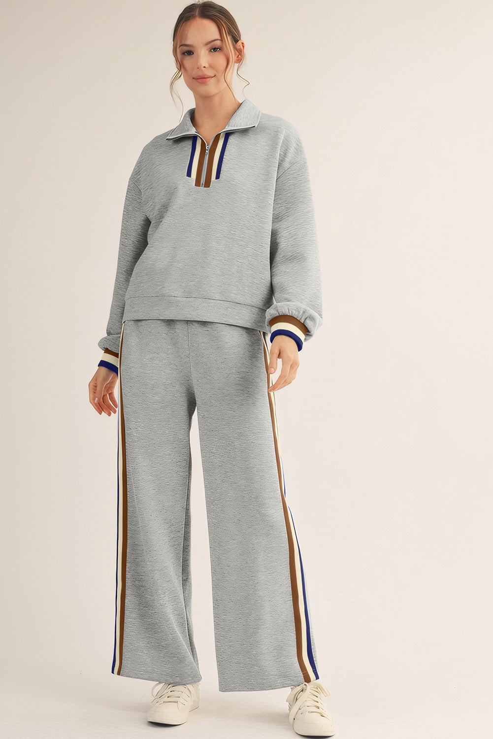Striped patchwork quarter zip pullover and loose pant set by Dear-Lover, black two-piece set with polyester, viscose, and elastane.