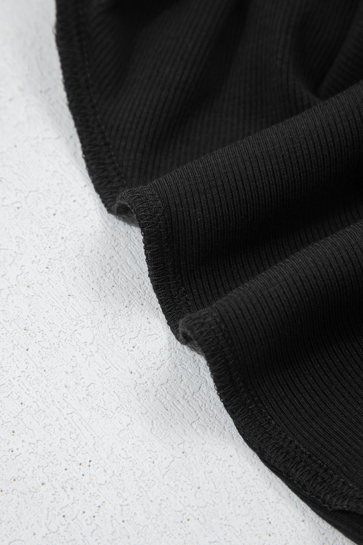 Black solid color oversized slit sweatshirt and ribbed leggings two-piece set by Dear-Lover, casual and comfortable clothing ensemble.