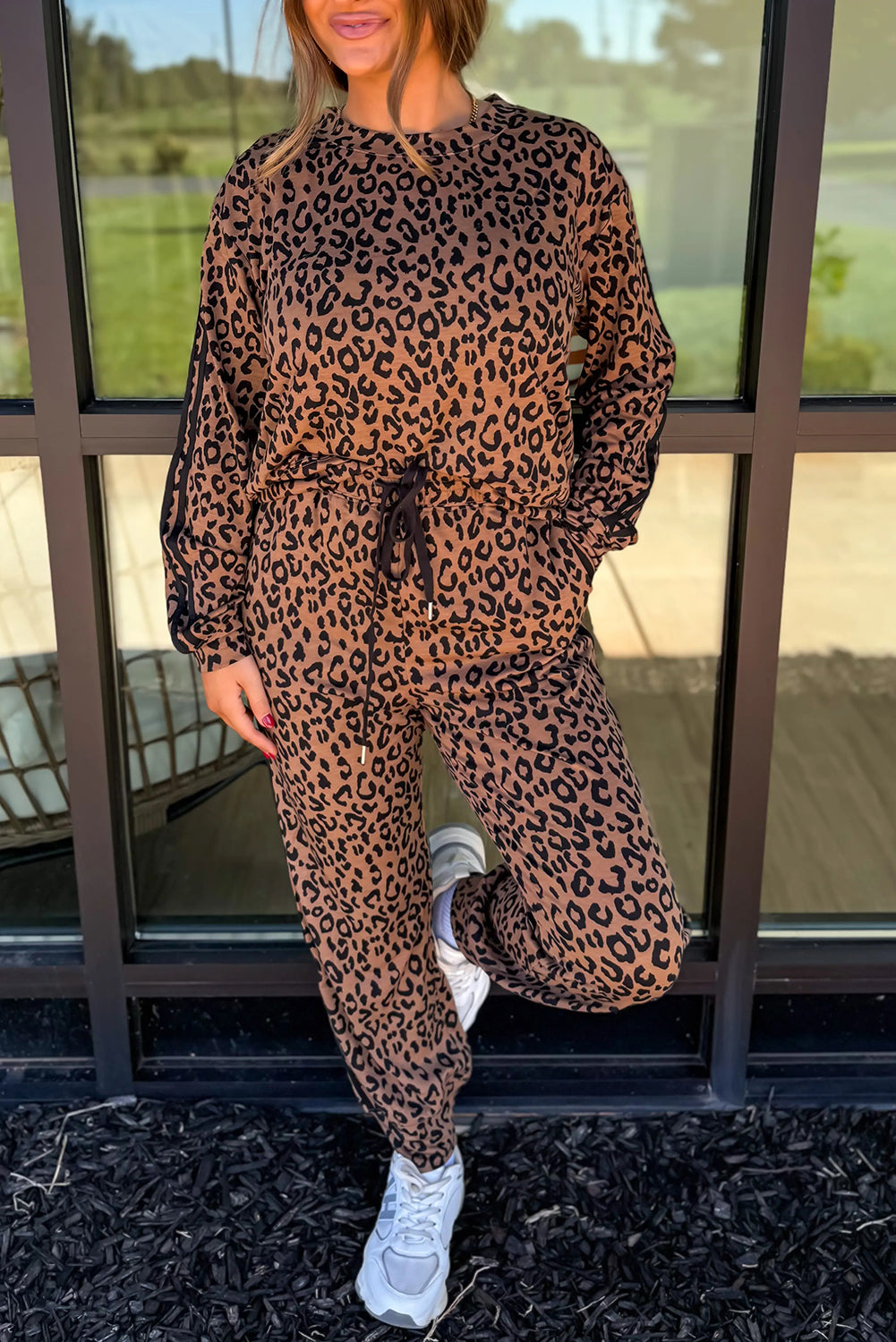 Brown varsity striped trim leopard print long sleeve top and drawstring pant set by Dear-Lover, two-piece polyester and elastane outfit.