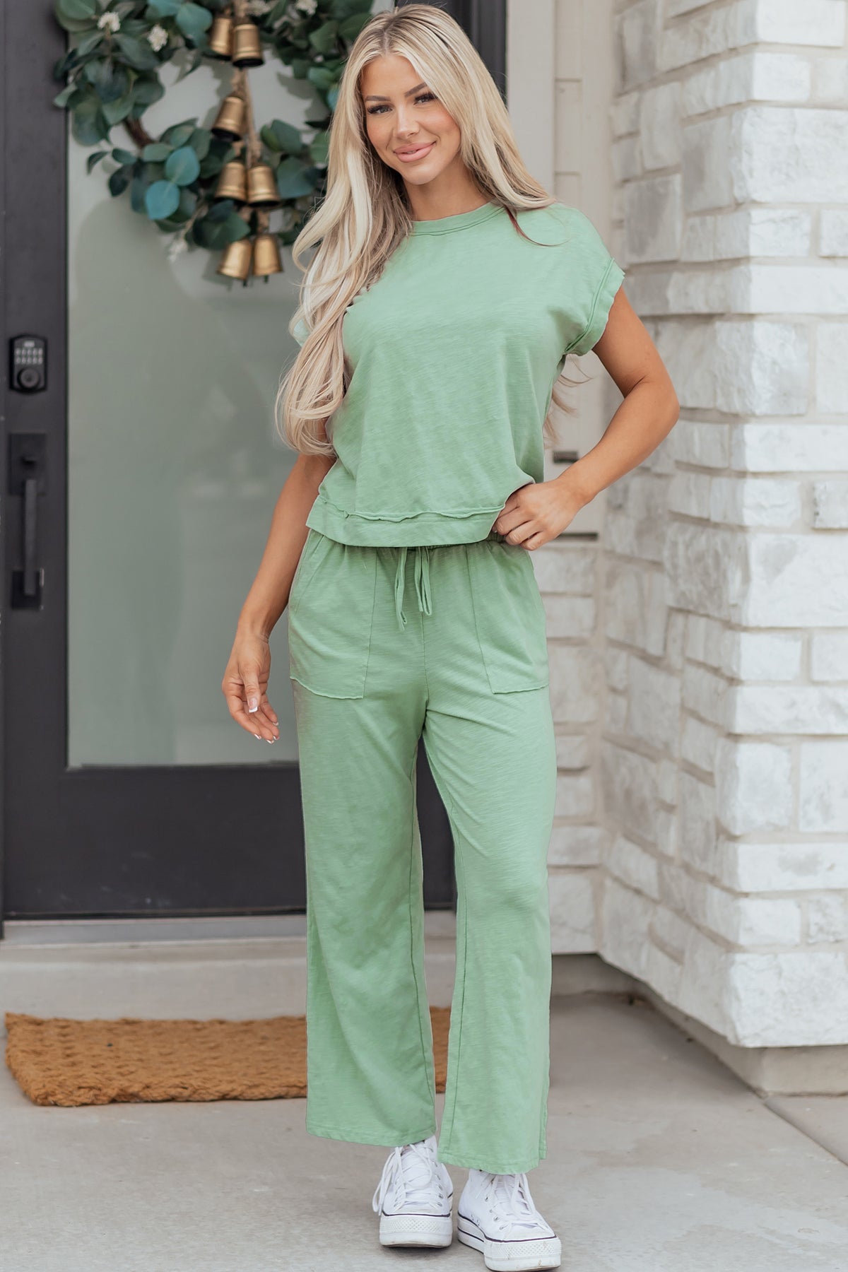 Dear-Lover two-piece set with cuffed short sleeve tee and drawstring patch pocket pants in polyester-cotton blend.
