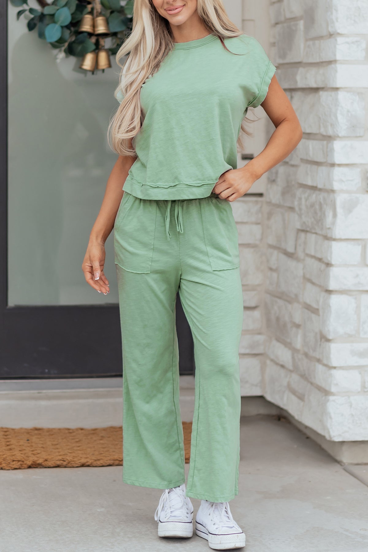 Dear-Lover two-piece set with a short sleeve tee and drawstring pants, featuring raw seams and patch pockets in polyester-cotton fabric.