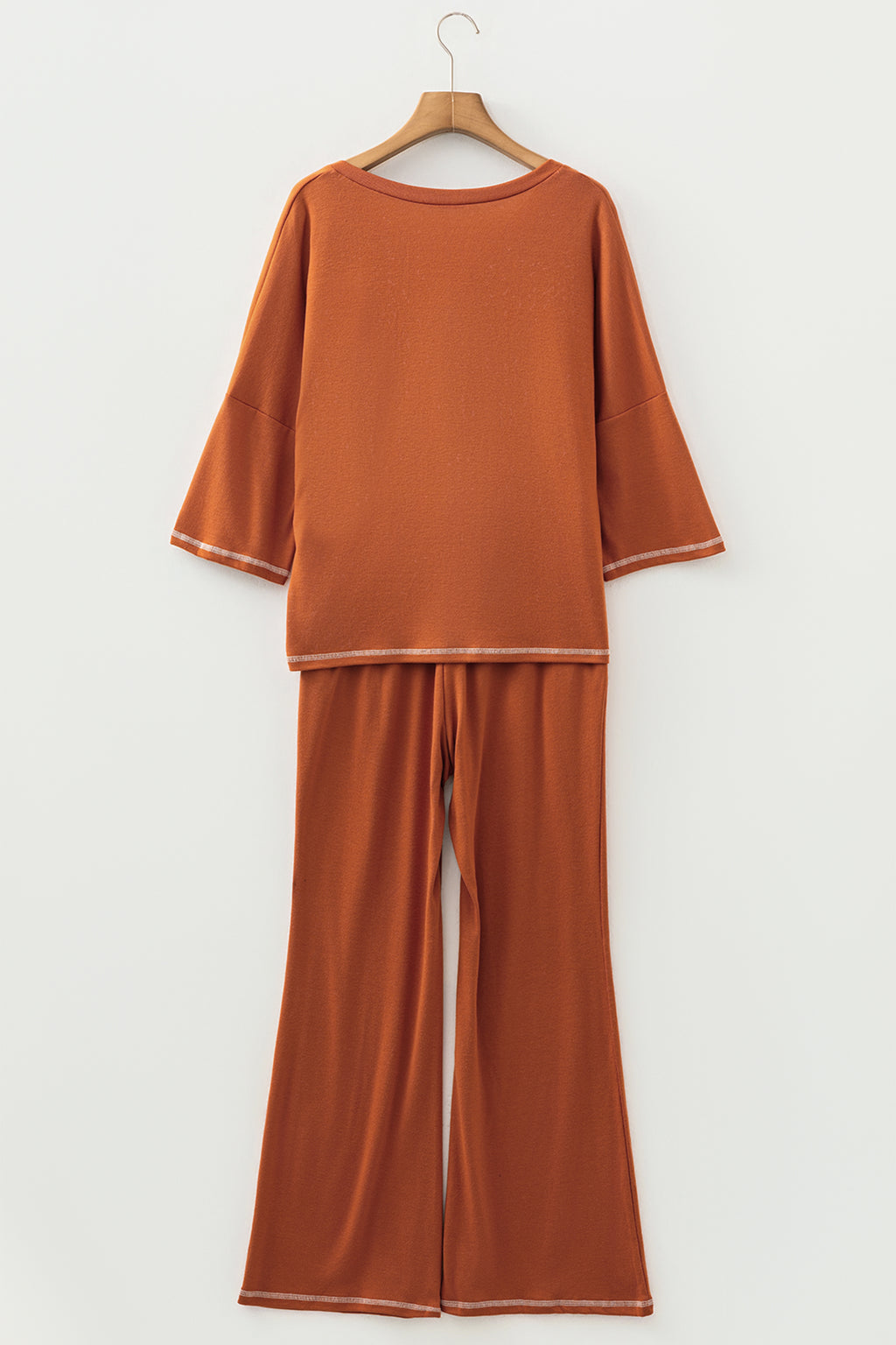 Dear-Lover orange two-piece set with contrast stitching, V-neck top with buttons, and drawstring flare pants, polyester blend.