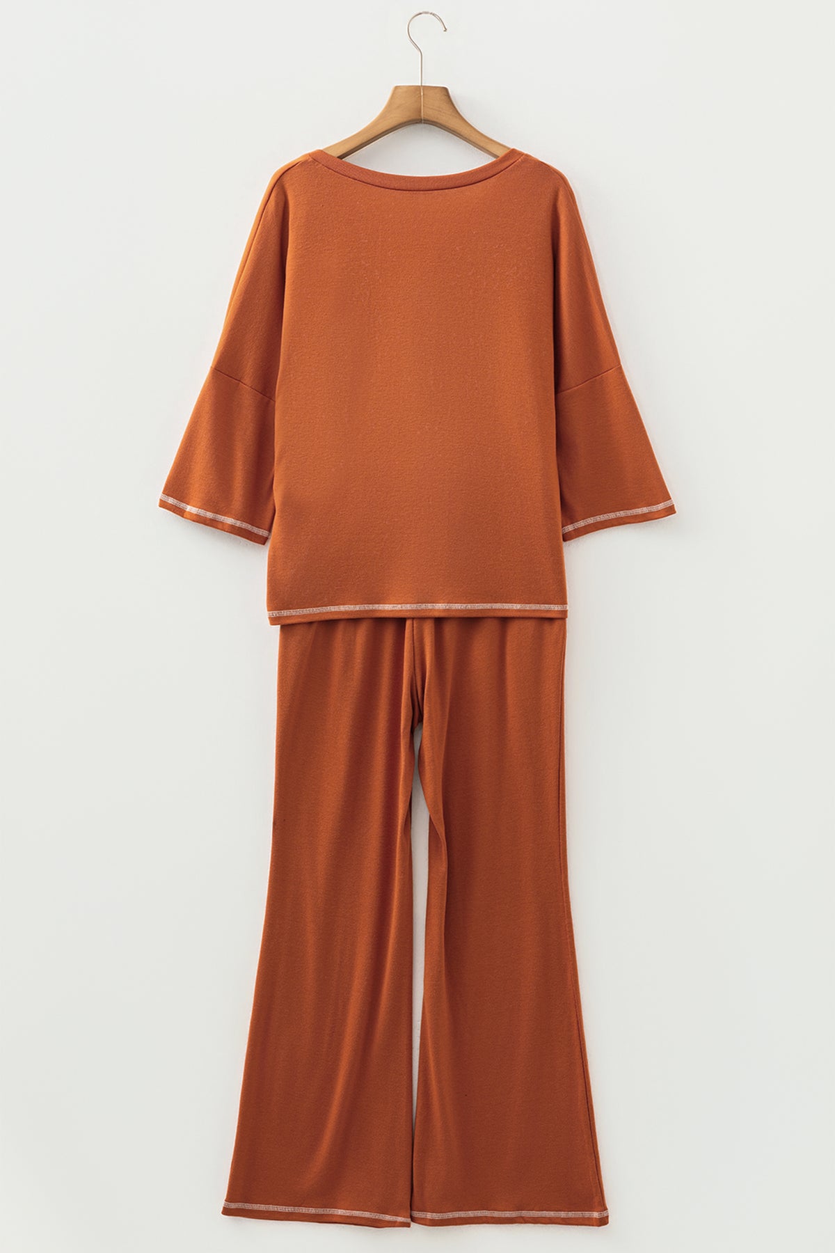 Dear-Lover orange two-piece set with contrast stitching, V-neck top with buttons, and drawstring flare pants, polyester blend.