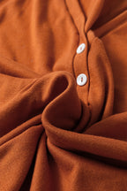 Orange two-piece set with contrast stitching, buttoned V-neck top and drawstring flare pants, by Dear-Lover Dropshipping.