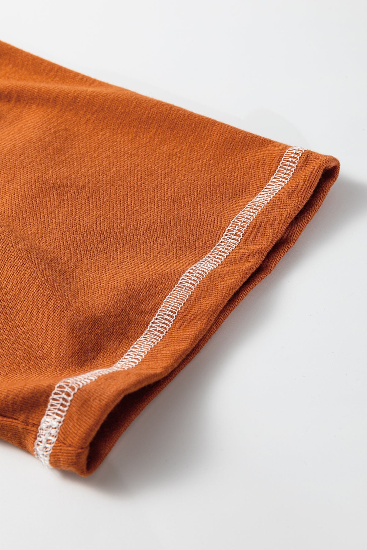 Dear-Lover orange two-piece set with contrast stitching, V-neck buttoned top, and flare pants with drawstring waist.