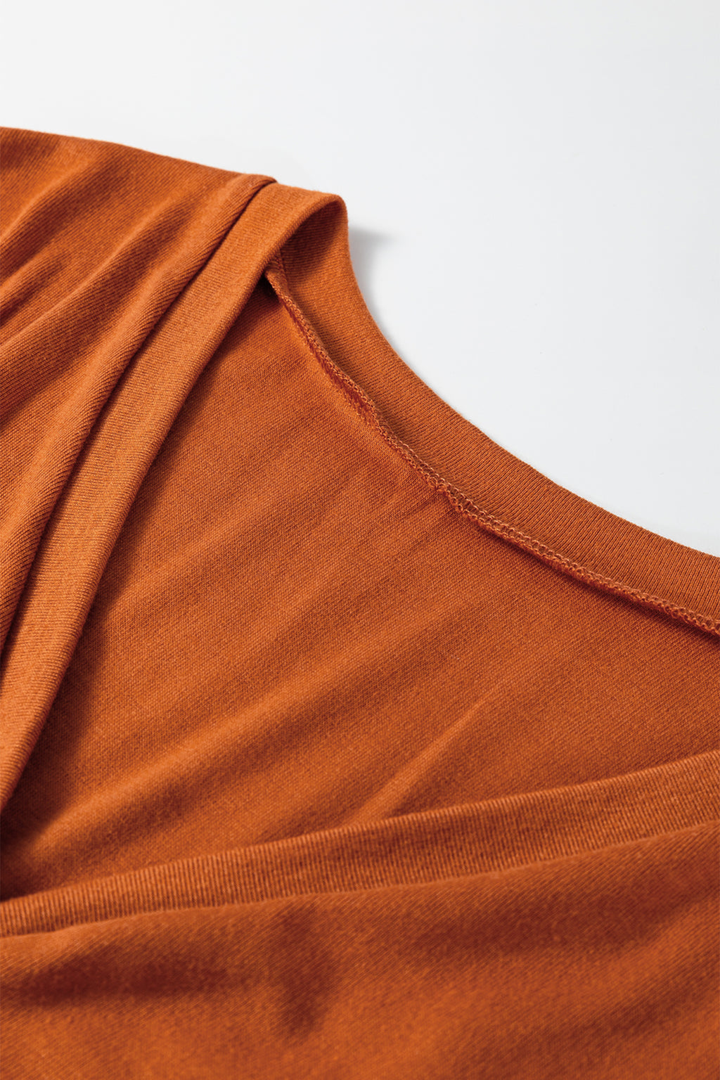 Dear-Lover orange two-piece set with contrast stitching, button V-neck top, and drawstring flare pants, made of polyester, viscose, and elastane.