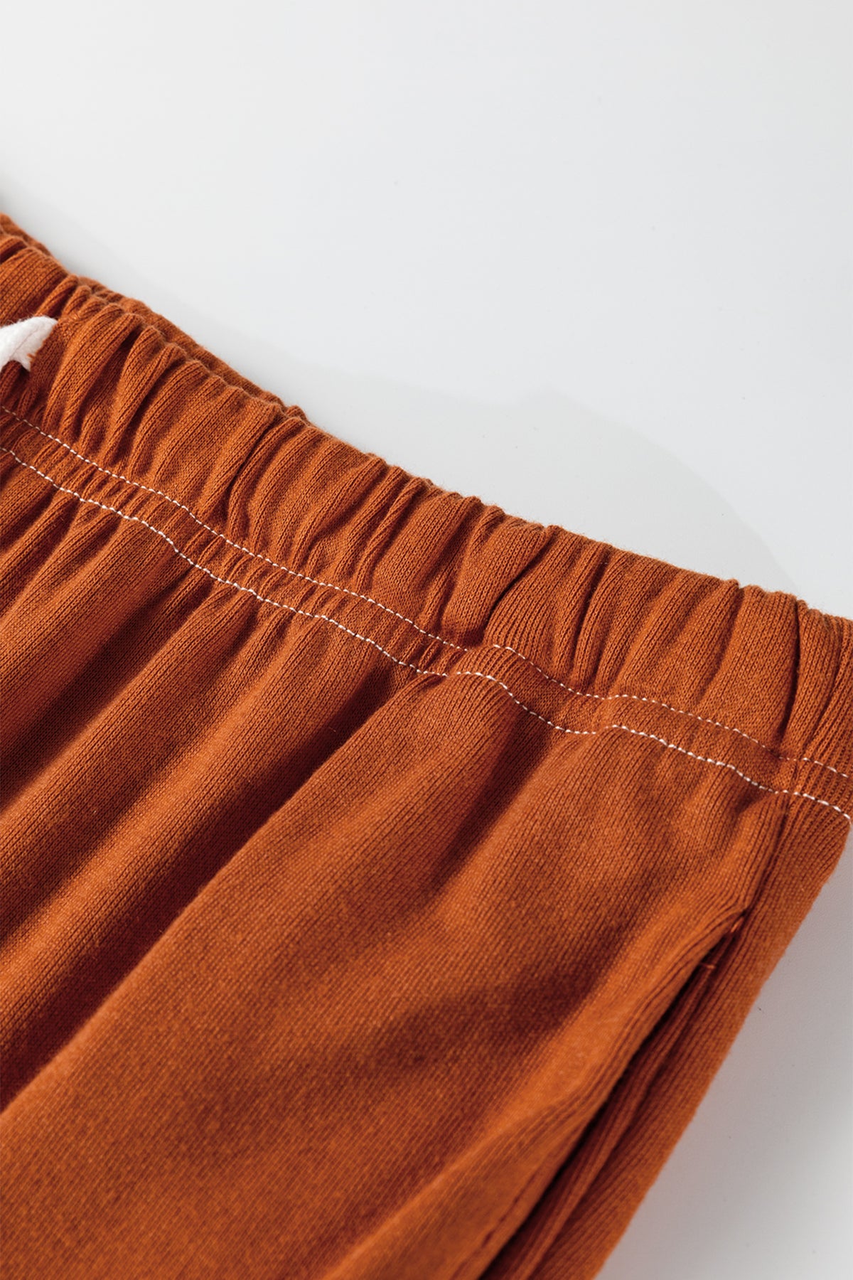 Grapefruit orange two-piece set with contrast stitching, buttoned V-neck top and drawstring flare pants from Dear-Lover Dropshipping