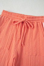 Grapefruit orange crochet floral accent V-neck textured pants set by Dear-Lover, two-piece pant set with vibrant pattern and stylish design.