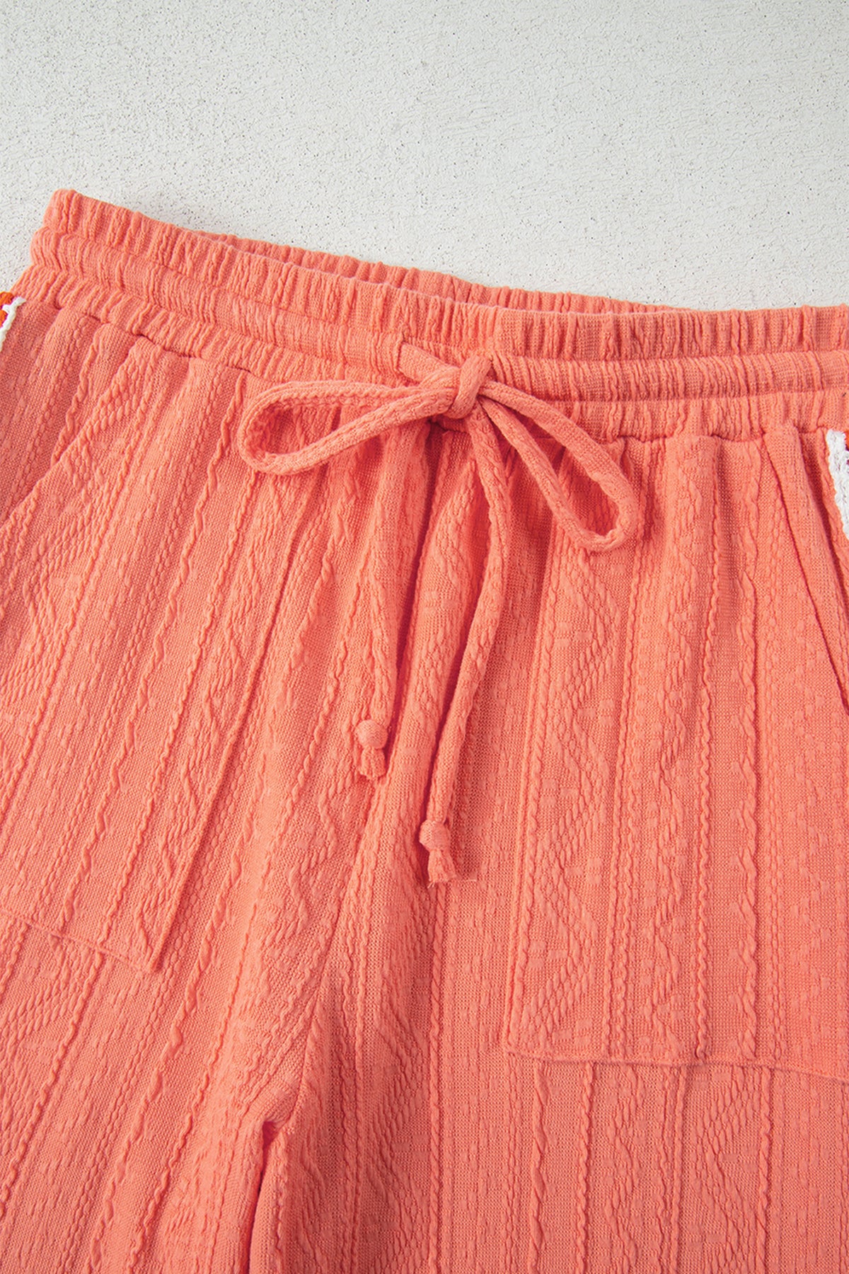 Grapefruit orange crochet floral accent V-neck textured pants set by Dear-Lover, two-piece pant set with vibrant pattern and stylish design.