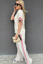 Dear-Lover two-piece set with contrast striped trim crewneck T-shirt and loose straight pants, made of polyester, viscose, elastane.