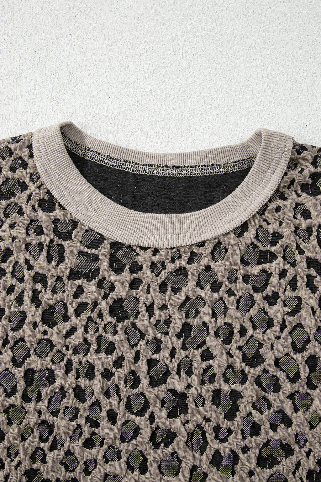 Khaki Jacquard Leopard two-piece pant set from Dear-Lover featuring half-sleeve jumper and wide-leg pants, made of polyester, cotton, and elastane.