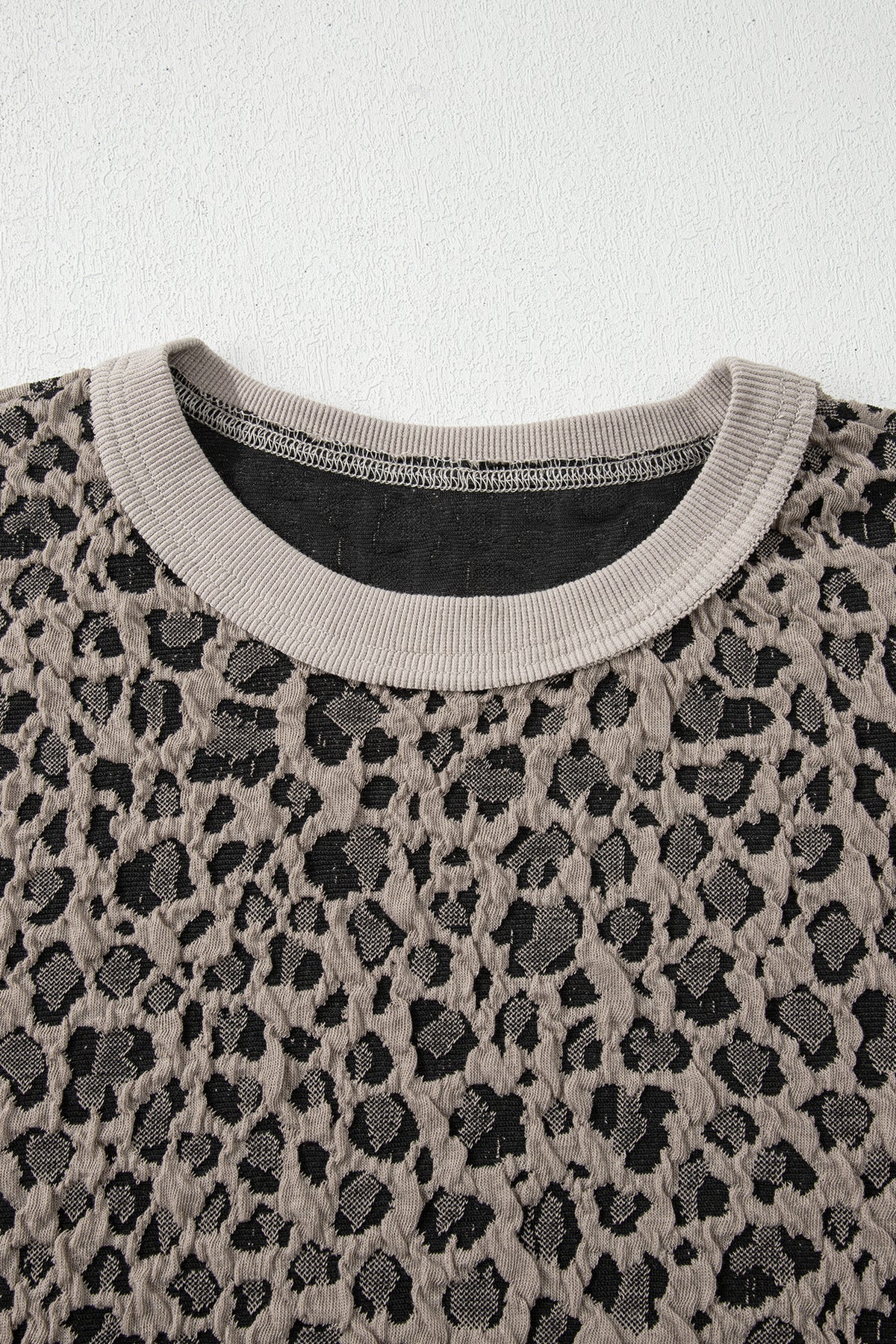 Khaki Jacquard Leopard two-piece pant set from Dear-Lover featuring half-sleeve jumper and wide-leg pants, made of polyester, cotton, and elastane.