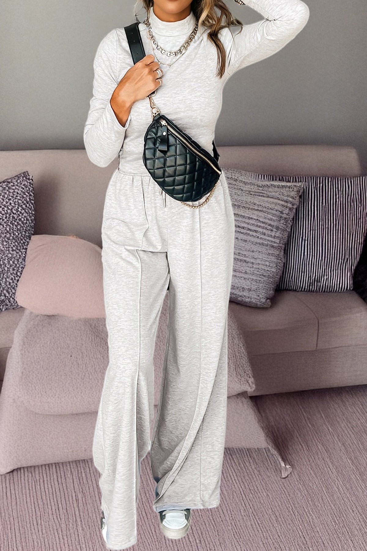 Light grey two-piece pant set with long sleeve high neck top and smocked waist from Dear-Lover, featuring central seam pants.