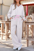 Light grey Dear-Lover two-piece pant set with frilled collar, drop shoulder pullover, and drawstring pants, made of polyester and cotton.