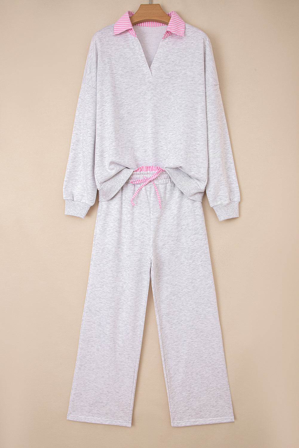 Light grey two-piece pant set from Dear-Lover with contrasting trim, frilled collar, drop shoulder pullover, and drawstring pants.