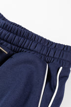 Navy blue contrast piping zipped pullover and cropped pants set by Dear-Lover, stylish two-piece cotton-polyester casual outfit.