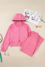 Pink solid color zip-up hoodie and loose drawstring pants set by Dear-Lover, made of polyester, viscose, and elastane for a comfortable fit.